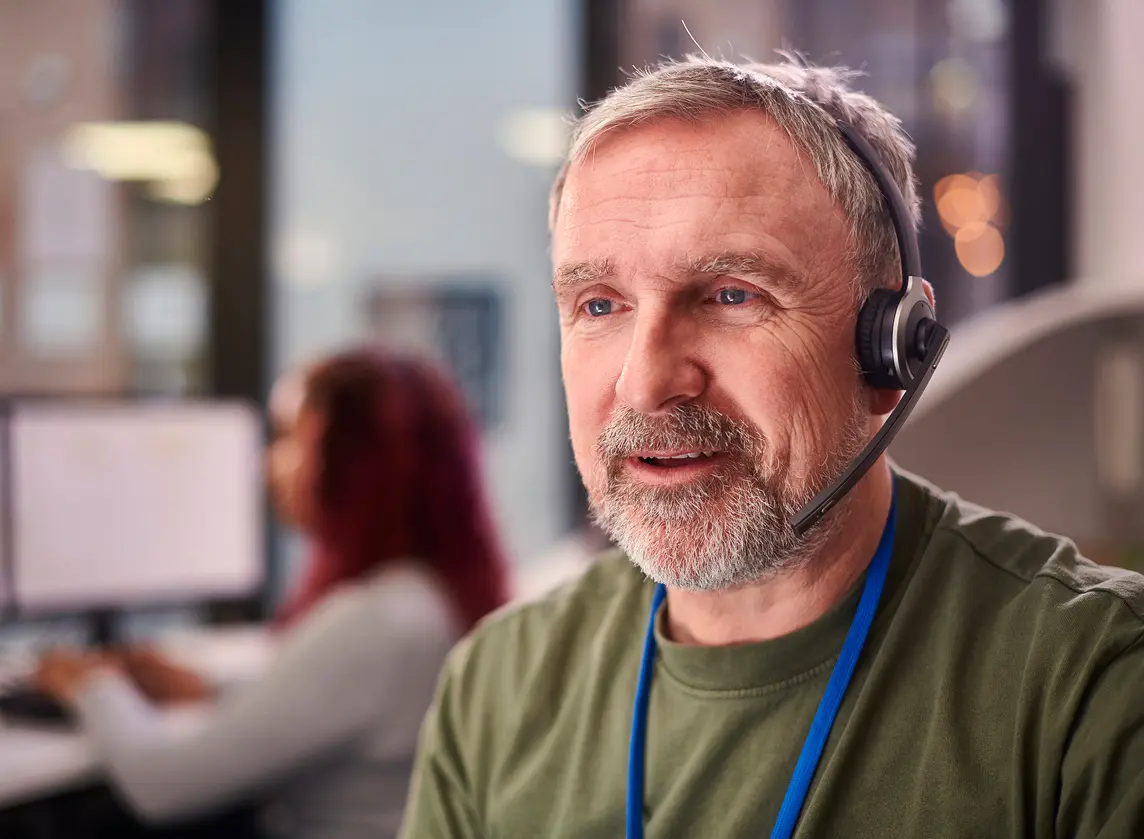 Man with headset in office setting