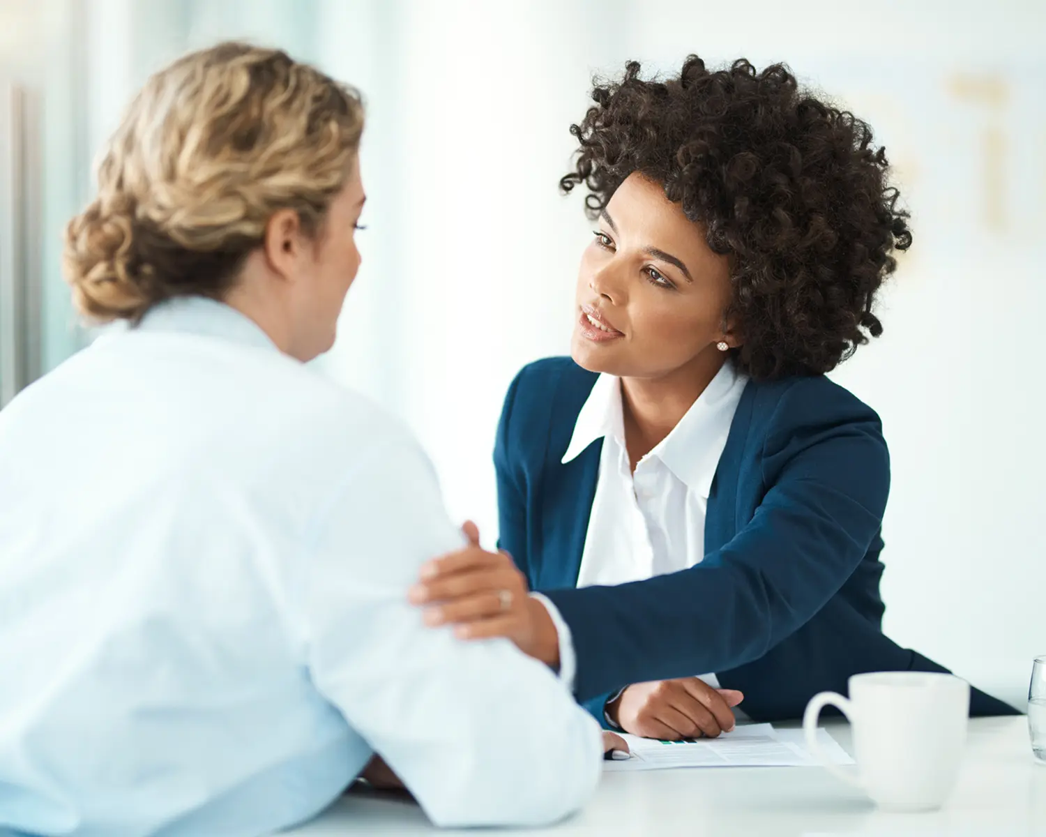 Two professionals having a supportive conversation