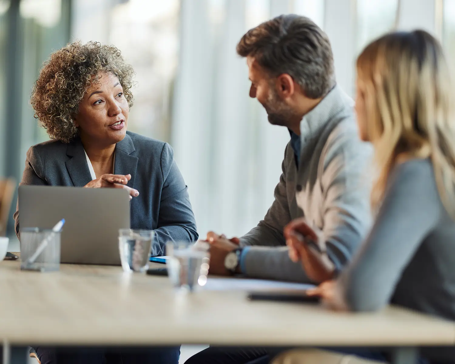 Colleagues conversing in a modern office