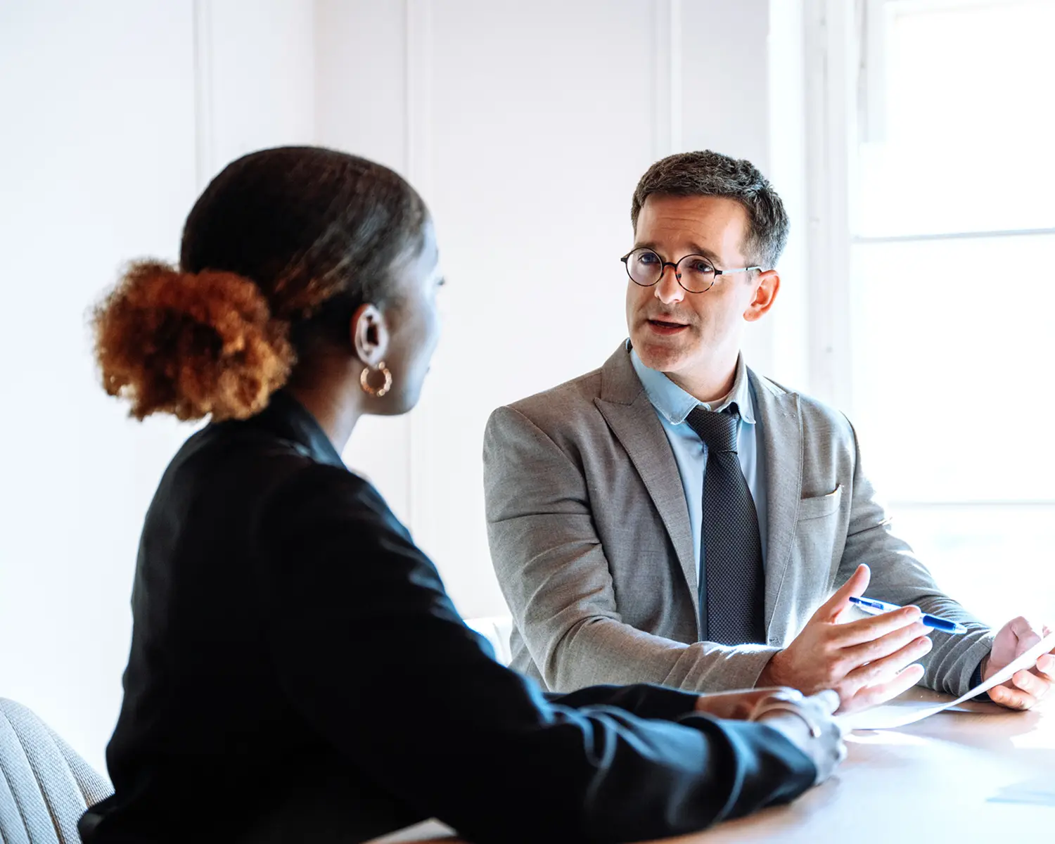 Man and woman in professional discussion