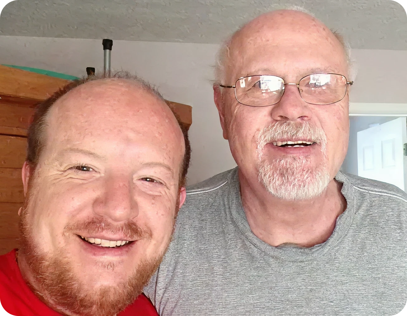 Father and son smiling together