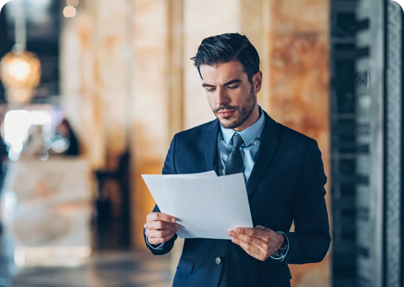 Businessman reading a document in office